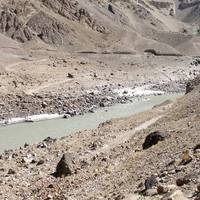 The Indus river flowing through a valley in Ladakh